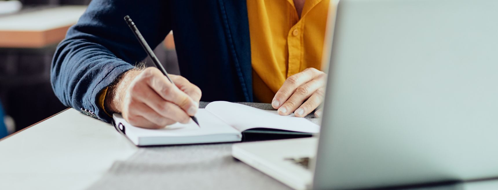 E-Commerce Professional Making a Checklist About Searchandising Testing